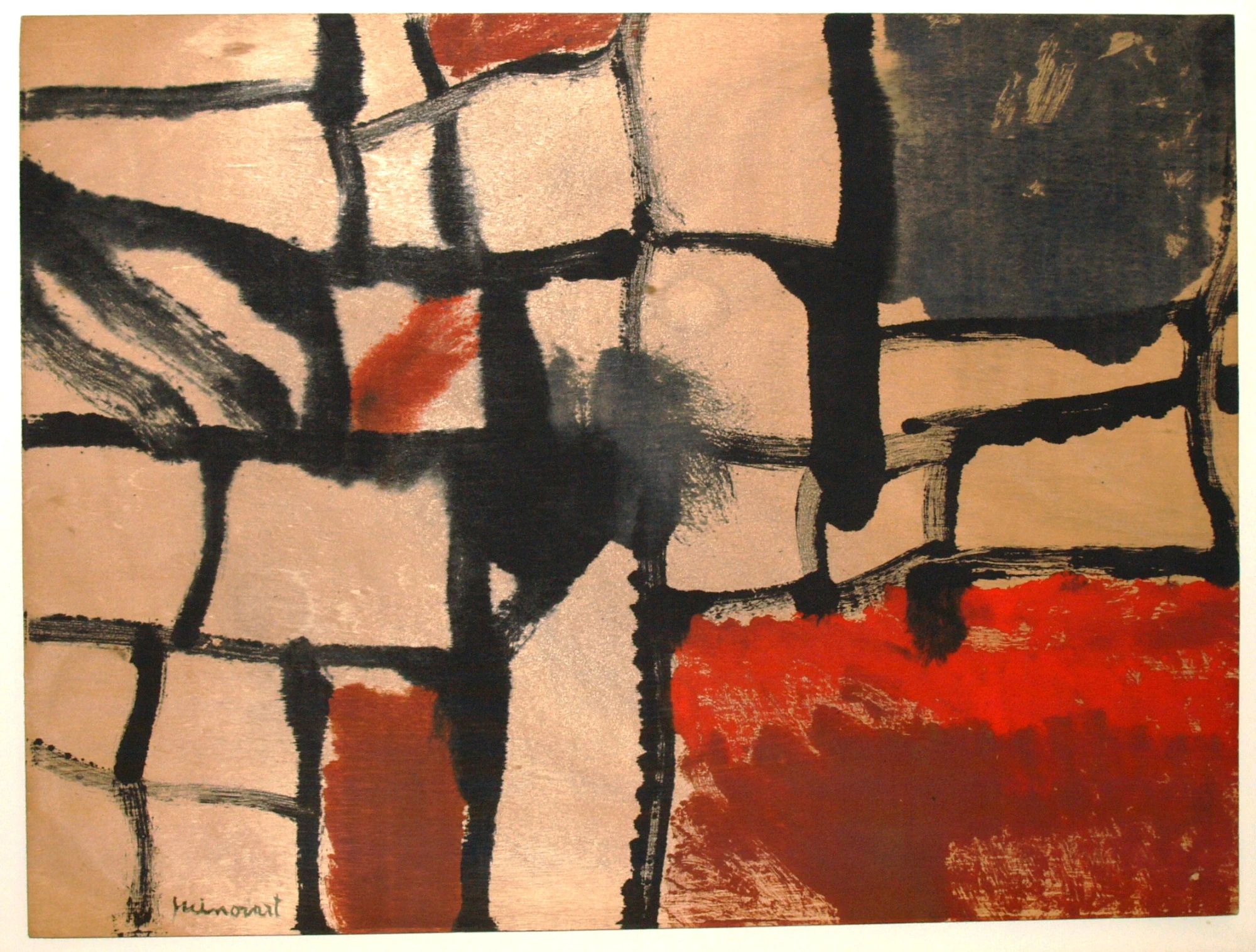 Se ve un cuadro abstracto con formas geométricas y tonos rojo, negro y beige sobre una pared.